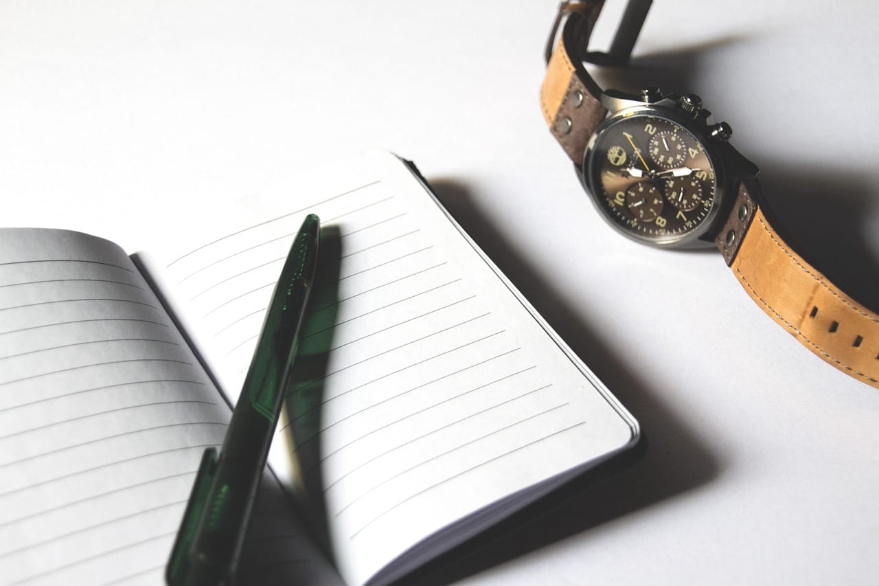 The day-30 review ends with one change to the onboarding plan, written by the new person.